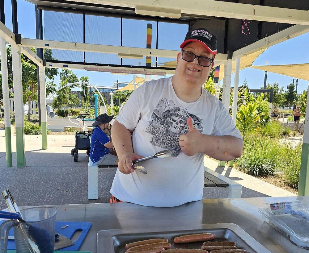 Compass Caboolture - trainee cooking a bbq